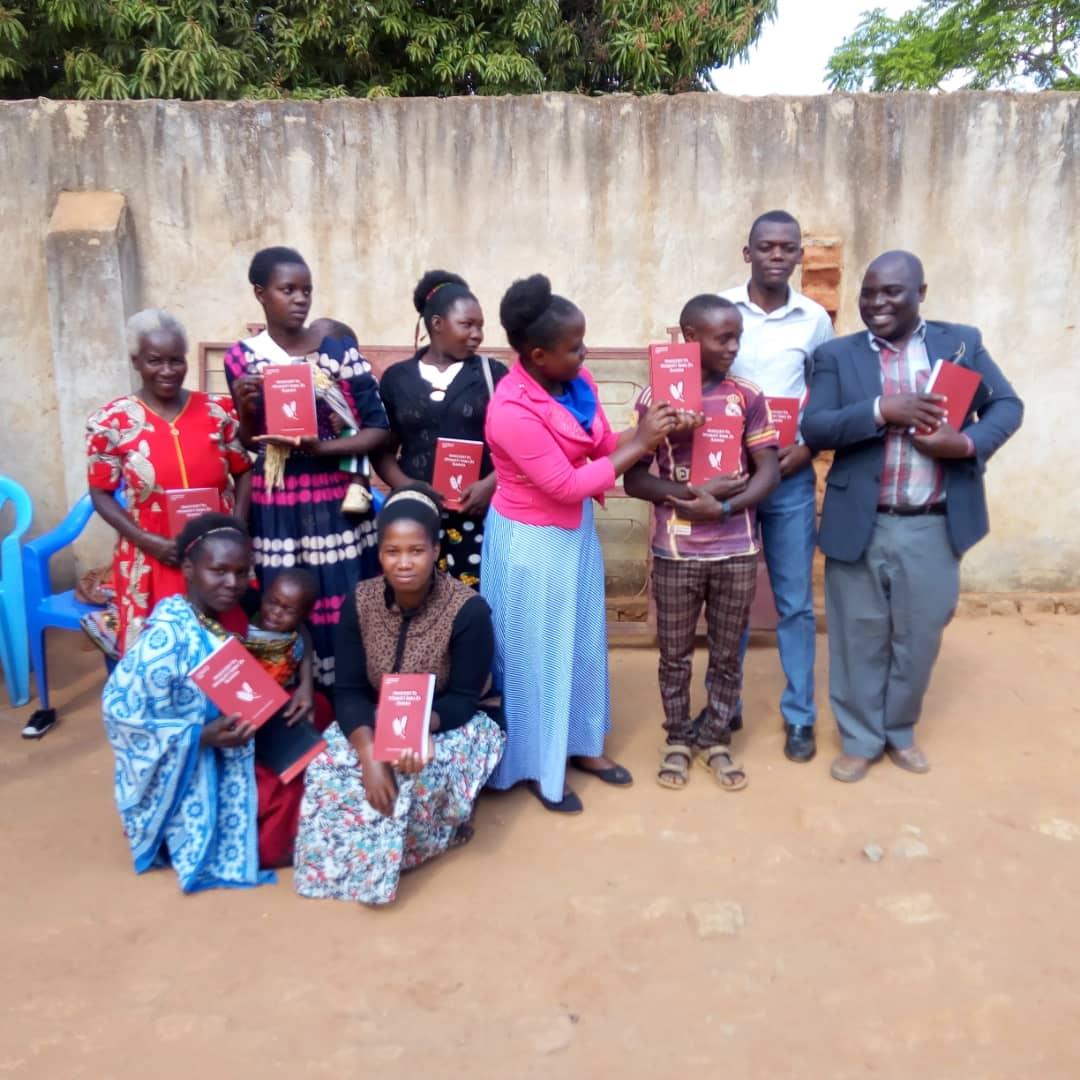 Believers in Africa receiving Swahili Church age Books printed through Vision Books.