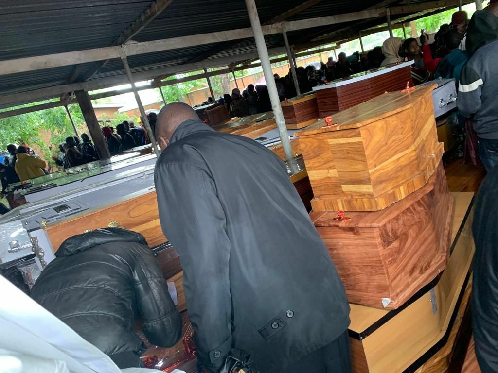 Coffins stacked up for a mass funeral that was held today.