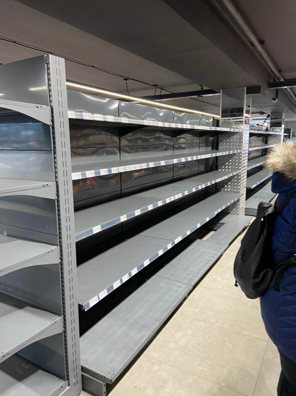 Empty shelves at grocery stores.