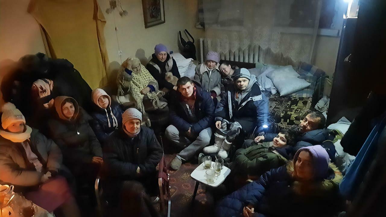 Family sheltering in the basement due to shelling around them during the night.